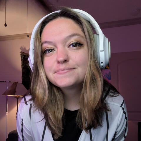 women wearing white headset smiling